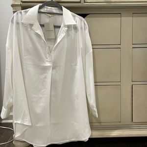 Eesome size small white blouse. I would say this could fit up to a large or xl